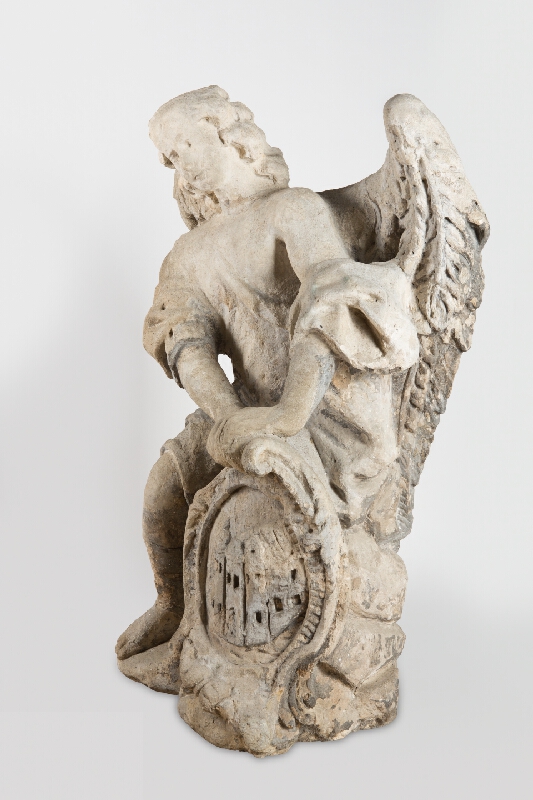 Viedenský sochár z 1. polovice 18. storočia – Kľačiaci anjel - štítonosič I. s kartušou s erbom  