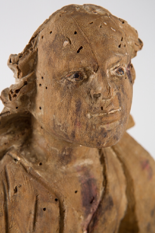 Slovenský ľudový rezbár z 1. polovice 19. storočia – Svätec s knihou 